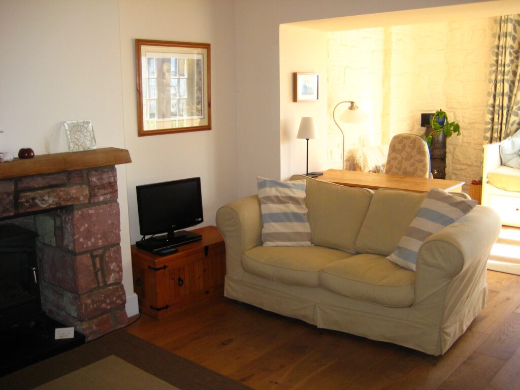 Living Room And Snug Seaside Cottage